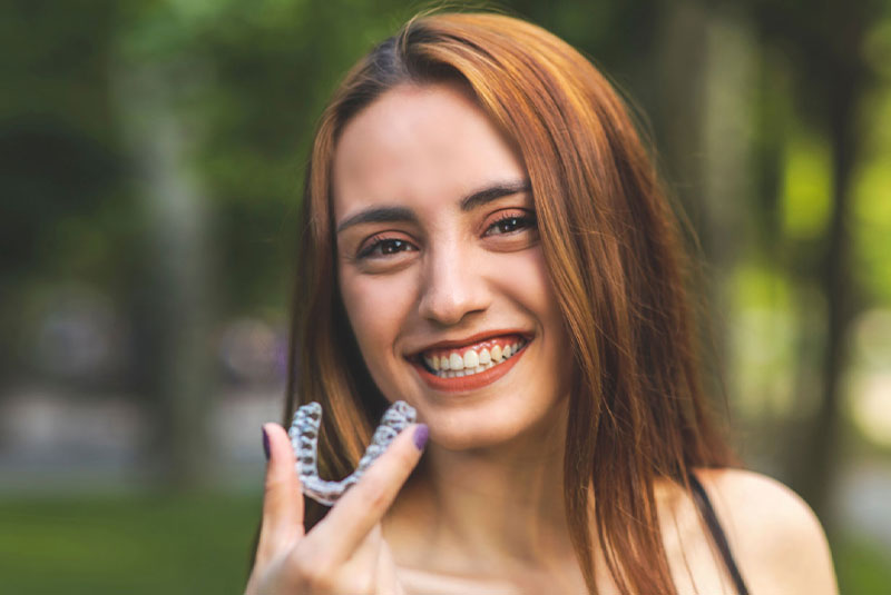 clear braces clear aligner being used