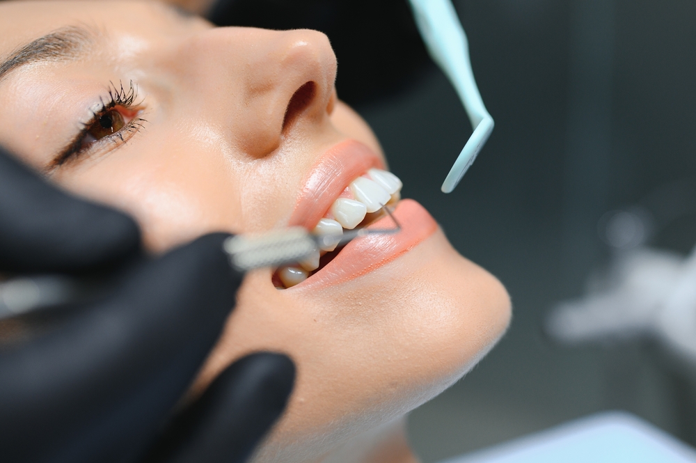 Patient consulting with dentist in a modern dental office setting